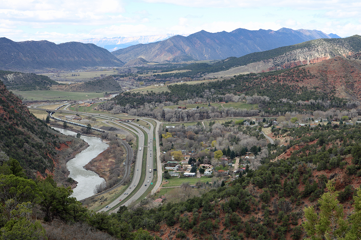 Interstate 70 and the Colorado River transect Garfield County, Colorado, which is perched between Rocky Mountain resorts and the natural resources industry. Pictured, the community of Chacra, about 8 miles west of the county seat Glenwood Springs.