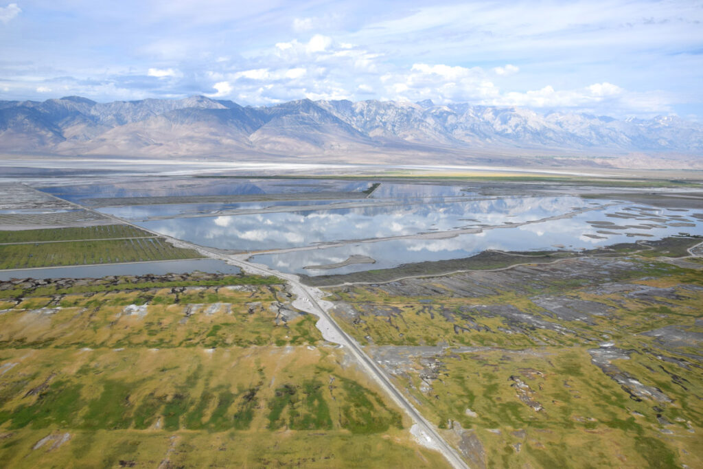 Aerial view of water retention ponds near the Sierra Nevada mountains. Since the early 2000s, the Los Angeles Department of Water and Power has been implementing dust control measures in the Owens Valley, including shallow flooding, managed vegetation, gravel, tillage, and others. Credit: LADWP