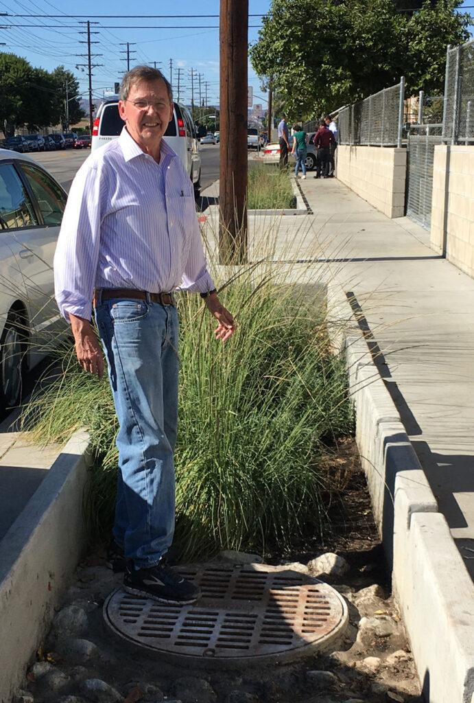Prof. Richard Luthy at a storm drain on Laurel Canyon Boulevard in Los Angeles. 