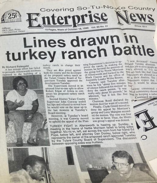 Photograph of a newspaper clipping from the So-Tu-No-Ke Country Enterprise News from October 18, 1990. The front page carries a banner headline, "Lines drawn in turkey ranch battle," below which are several portraits including a picture of Nettie Morrison, whose children and grandchildren would go on to work towards improving the town of Allensworth.