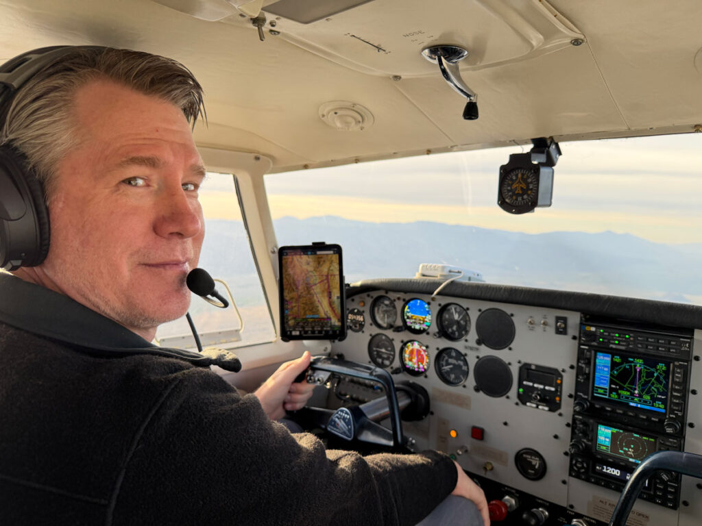 Chris Rowan at the controls of his Piper PA-24 Comanche